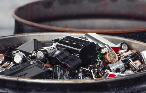 Household batteries in a trash bin