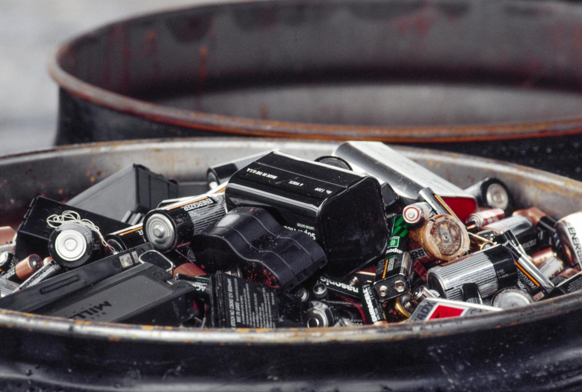 Household batteries in a trash bin