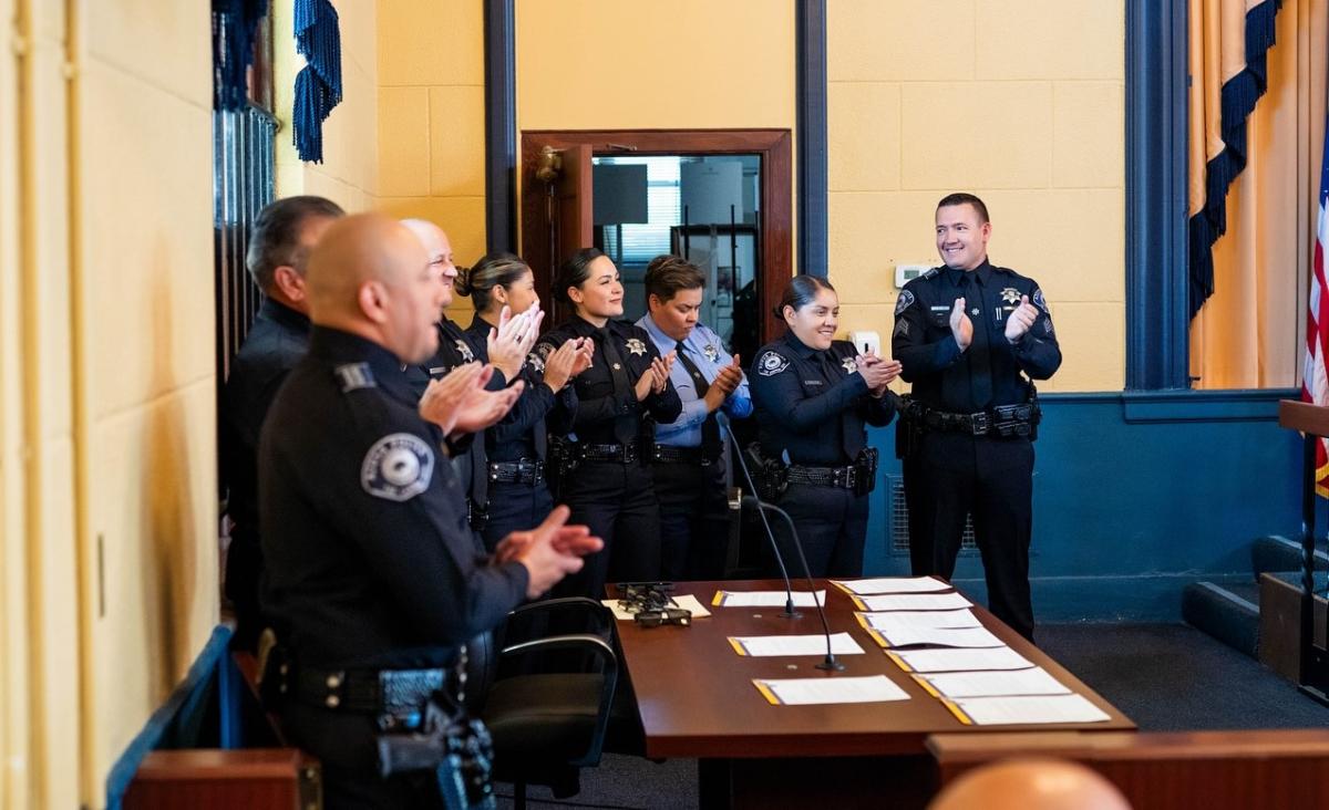 Police officers clapping